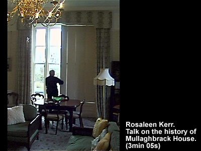 Silouette of Rosaleen Kerr opening shutters in Mullaghbrack House in 2003.